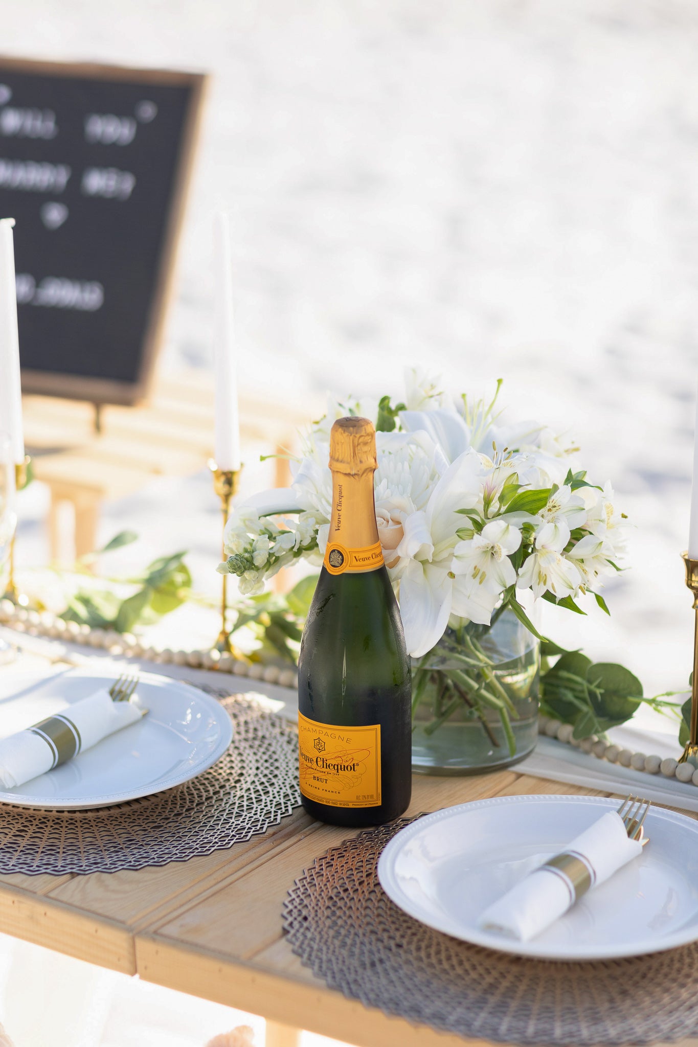 champagne on the beach with luxury picnic company Picnic Goals