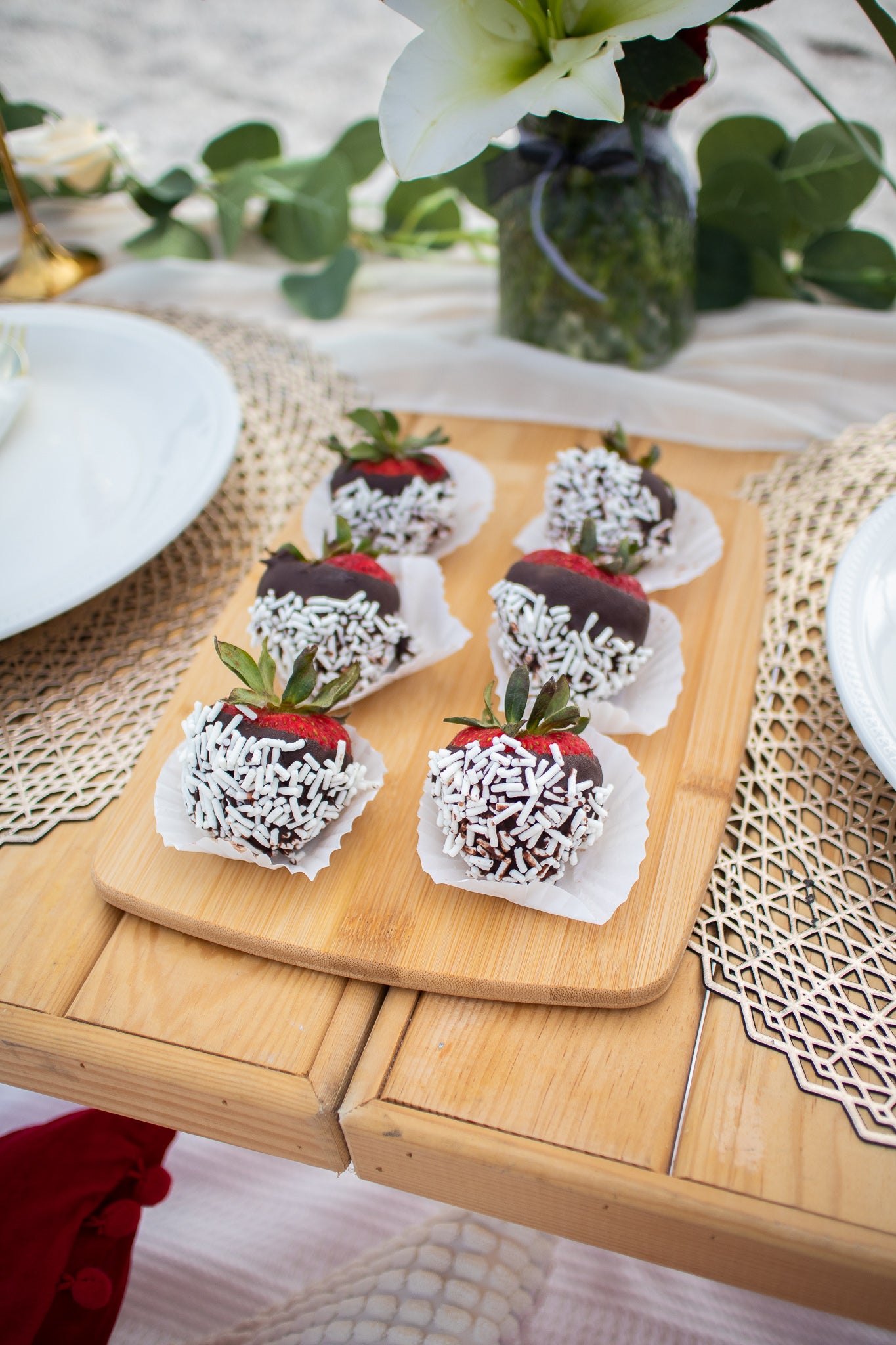 chocolate covered strawberries with couples date on the beach