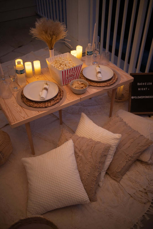 Polished Picnic setup "Netflix and Chill" on home balcony at night